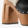 Alida Platform 135 – Sandali con cinturino posteriore in pelle di vitello lucida nera con shearling Alida Platform 135 – Sandali con cinturino posteriore in pelle di vitello lucida nera con shearling