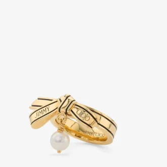 Anello con nastro Anello con perla e nastro in metallo dorato Anello con nastro Anello con perla e nastro in metallo dorato