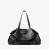 Bar Holdall Large: borsa tote nera in morbida pelle di vitello martellata con stelle in rilievo Bar Holdall Large: borsa tote nera in morbida pelle di vitello martellata con stelle in rilievo