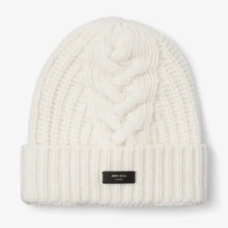 Berretto Yuki a trecce color latte con etichetta in pelle