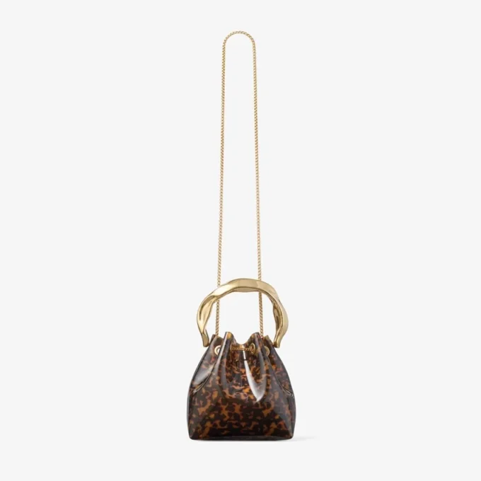 Borsa a secchiello Bon Bon trasparente tartarugata con manico scolpito Borsa a secchiello Bon Bon trasparente tartarugata con manico scolpito