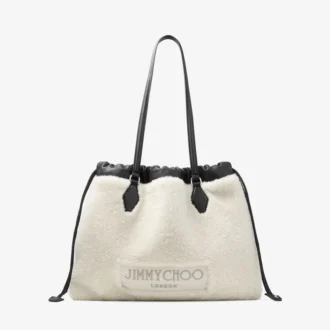 Borsa tote con coulisse Borsa tote media in shearling naturale con coulisse e finiture in pelle