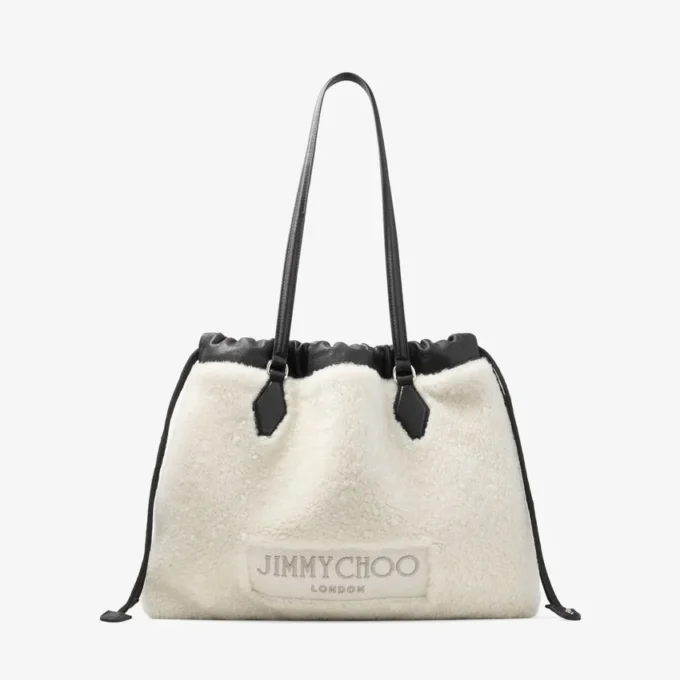 Borsa tote con coulisse Borsa tote media in shearling naturale con coulisse e finiture in pelle