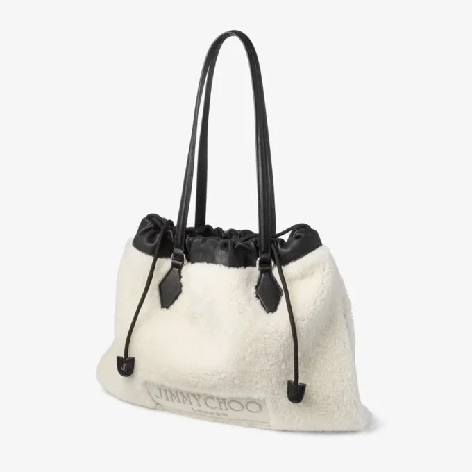 Borsa tote con coulisse Borsa tote media in shearling naturale con coulisse e finiture in pelle