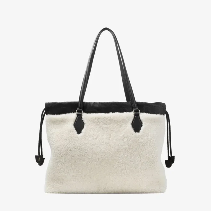 Borsa tote con coulisse Borsa tote media in shearling naturale con coulisse e finiture in pelle
