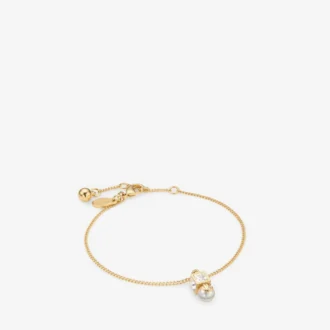 Bracciale Jc Pearl Cube in metallo dorato con perla e cubo di cristallo Bracciale Jc Pearl Cube in metallo dorato con perla e cubo di cristallo