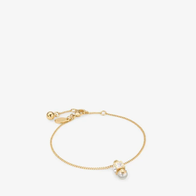 Bracciale Jc Pearl Cube in metallo dorato con perla e cubo di cristallo Bracciale Jc Pearl Cube in metallo dorato con perla e cubo di cristallo