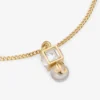 Bracciale Jc Pearl Cube in metallo dorato con perla e cubo di cristallo Bracciale Jc Pearl Cube in metallo dorato con perla e cubo di cristallo