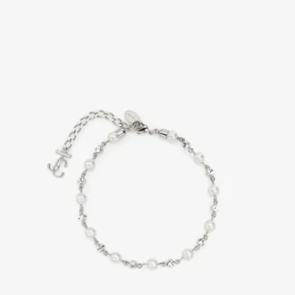 Cavigliera con perla e cristalli Cavigliera in metallo con finitura argento con ciondoli a forma di perla, cristallo e monogramma Jc