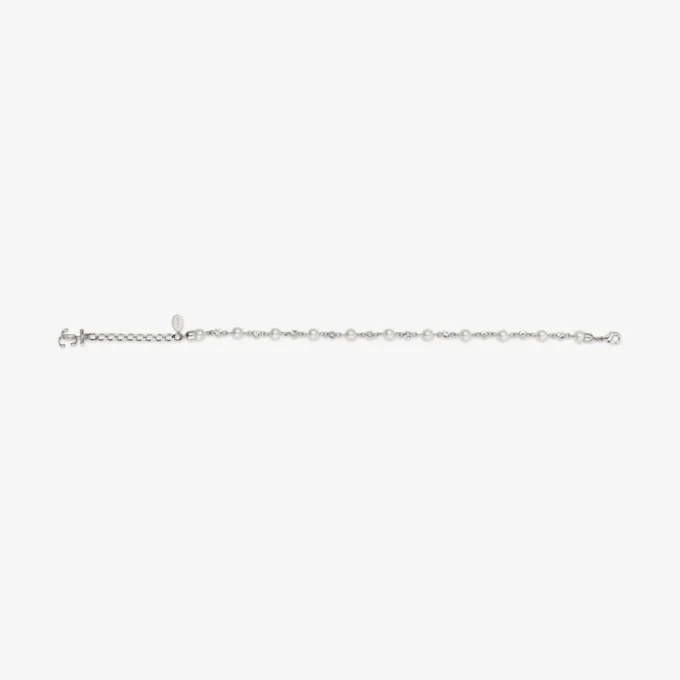 Cavigliera con perla e cristalli Cavigliera in metallo con finitura argento con ciondoli a forma di perla, cristallo e monogramma Jc Cavigliera con perla e cristalli Cavigliera in metallo con finitura argento con ciondoli a forma di perla, cristallo e monogramma Jc