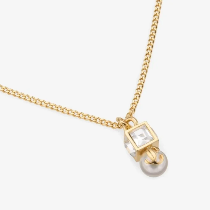 Ciondolo Jc Pearl Cube in metallo dorato con perla e cubo di cristallo Ciondolo Jc Pearl Cube in metallo dorato con perla e cubo di cristallo