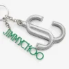 Ciondolo per borsa Jc Multi Charm in nappa metallizzata argento e verde con logo a stella Ciondolo per borsa Jc Multi Charm in nappa metallizzata argento e verde con logo a stella