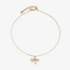 Collana con ciondolo a nastro Collana con ciondolo in metallo dorato con nastro e perla