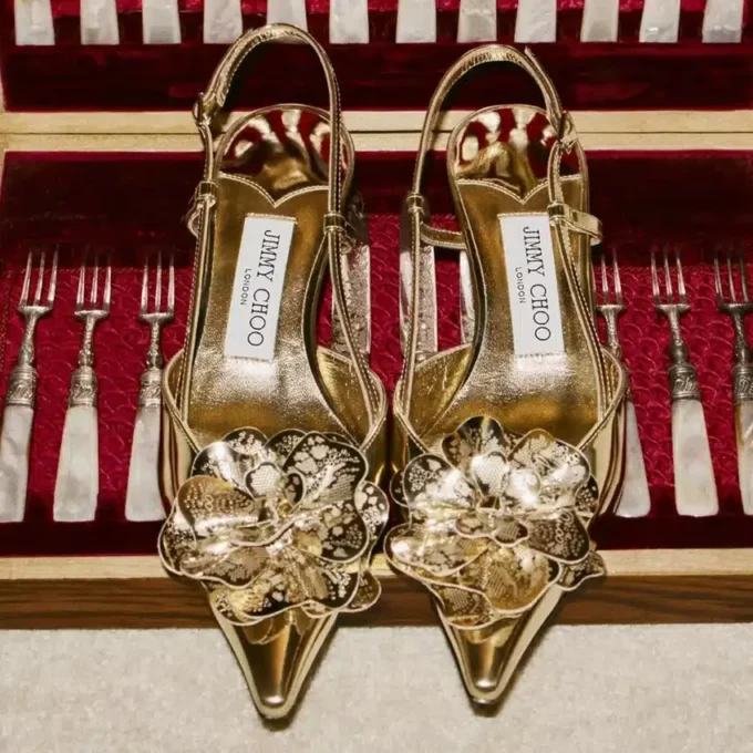 Mimmi Sling Back 50 Sandali con cinturino posteriore in pelle Liquid Metal dorata con corsage traforato jimmy choo Mimmi Sling Back 50 Sandali con cinturino posteriore in pelle Liquid Metal dorata con corsage traforato jimmy choo