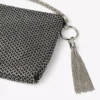 Pochette Callie in pelle scamosciata con motivo a rombi neri e cristalli hotfix Pochette Callie in pelle scamosciata con motivo a rombi neri e cristalli hotfix