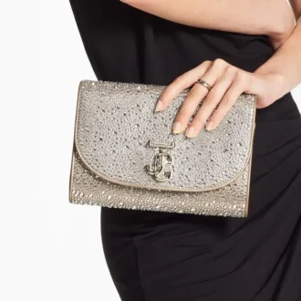 Pochette Curve in pelle scamosciata dorata lucida con cristalli Hotfix