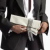 Pochette Zandra in morbida pelle scamosciata dorata lucida con bracciale a catena Pochette Zandra in morbida pelle scamosciata dorata lucida con bracciale a catena