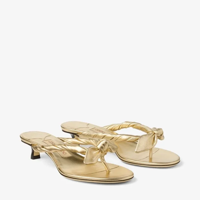 Sandali mules Liss 35 in pelle nappa metallizzata dorata con fiocco Sandali mules Liss 35 in pelle nappa metallizzata dorata con fiocco