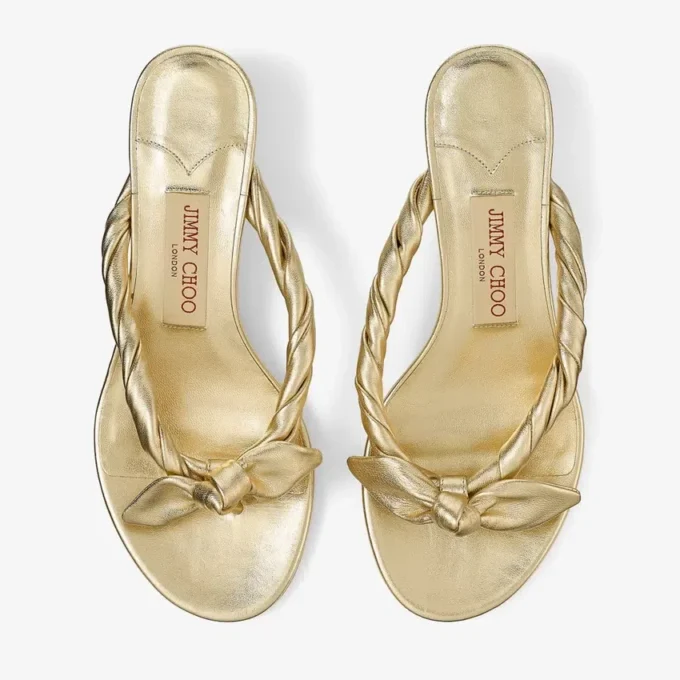 Sandali mules Liss 35 in pelle nappa metallizzata dorata con fiocco Sandali mules Liss 35 in pelle nappa metallizzata dorata con fiocco