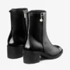 Stivaletti Adry 60 in pelle verniciata nera e nappa con ciondolo a forma di perla Stivaletti Adry 60 in pelle verniciata nera e nappa con ciondolo a forma di perla